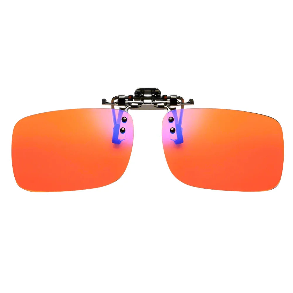 Rectangular orange clip-on sunglasses lenses with a black metal hinge on white background