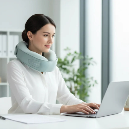 Woman using neck massager at desk, working on laptop in bright office, Sleep Oasis wellness gift