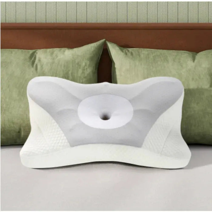 Orthopedic cervical pillow with ergonomic contour for neck support on a bed