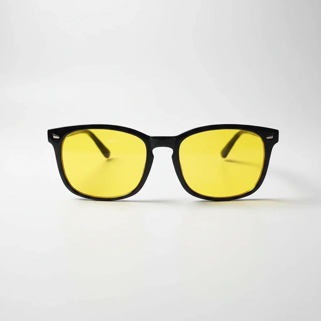 Yellow-tinted blue light glasses with black frames for better sleep and eye comfort