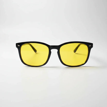 Yellow-tinted blue light glasses with black frames for better sleep and eye comfort